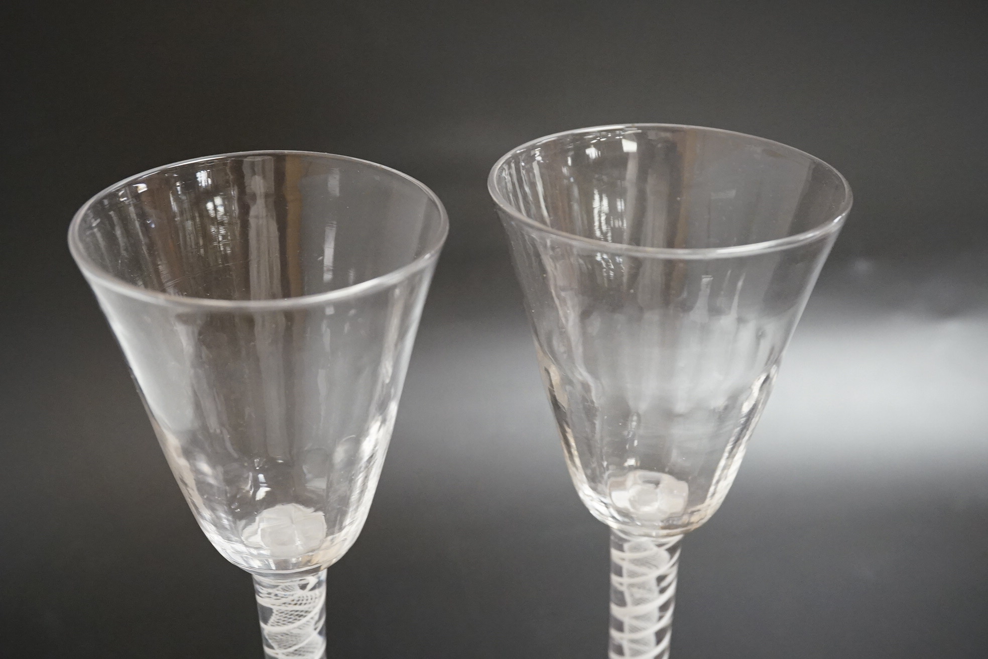 A near pair of opaque twist wine glasses, c.1760, 17.3cm high